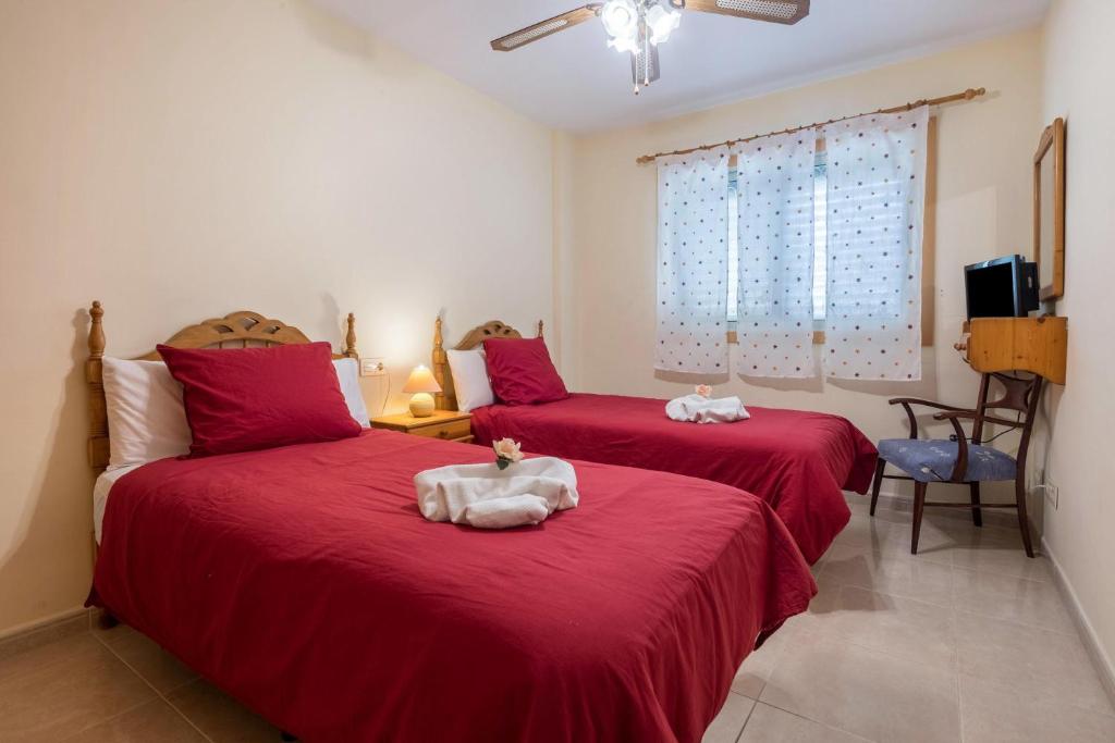 Łóżko lub łóżka w pokoju w obiekcie Apartamento en el Médano