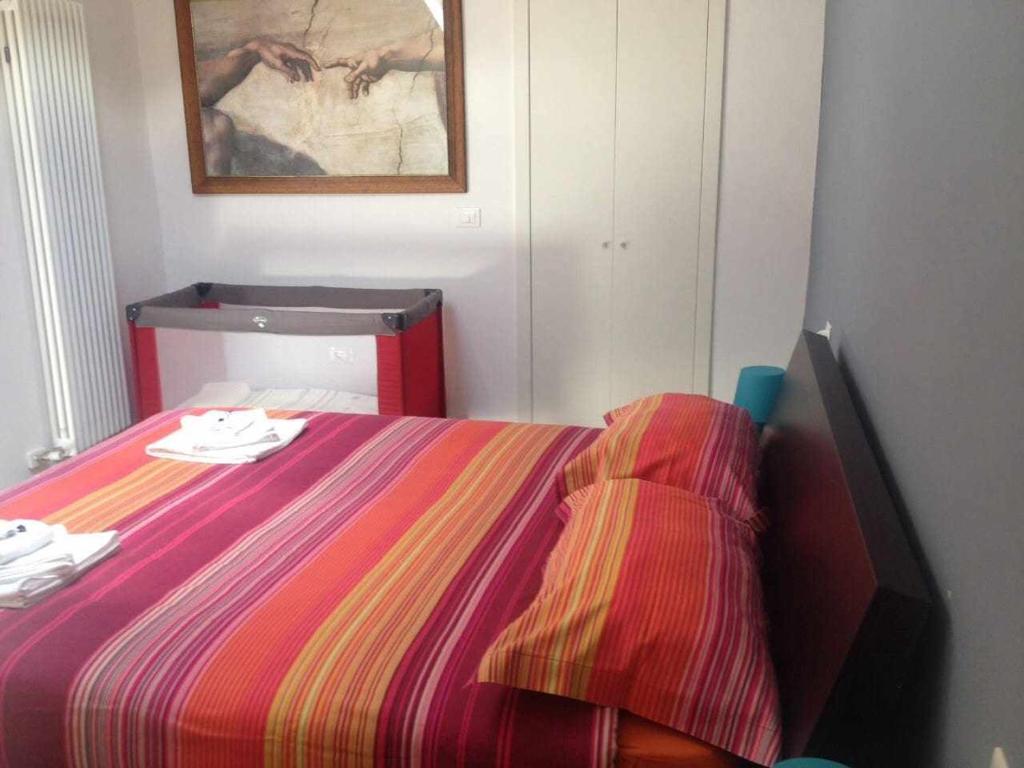 Łóżko lub łóżka w pokoju w obiekcie Relax Suite Holiday Apartment CIN IT02215CPAJVF