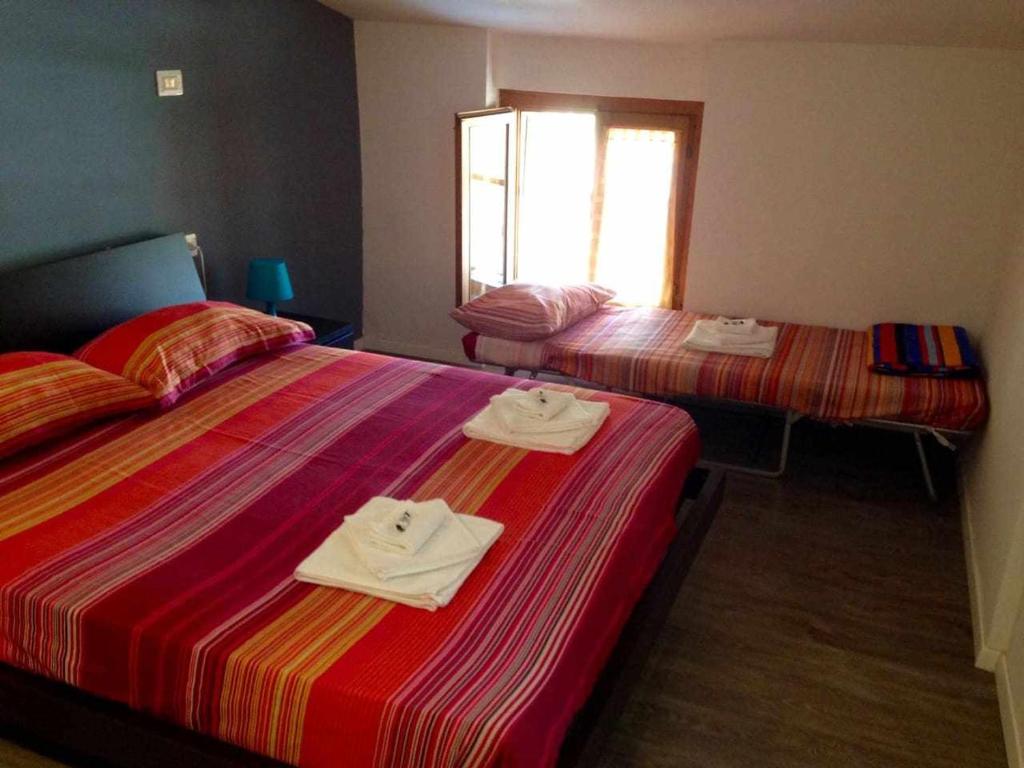 Łóżko lub łóżka w pokoju w obiekcie Relax Suite Holiday Apartment CIN IT02215CPAJVF