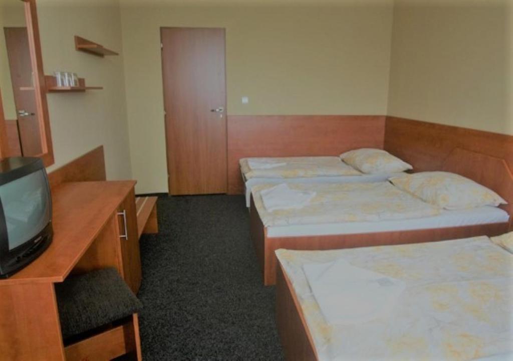 Postel nebo postele na pokoji v ubytování Hotel Panorama