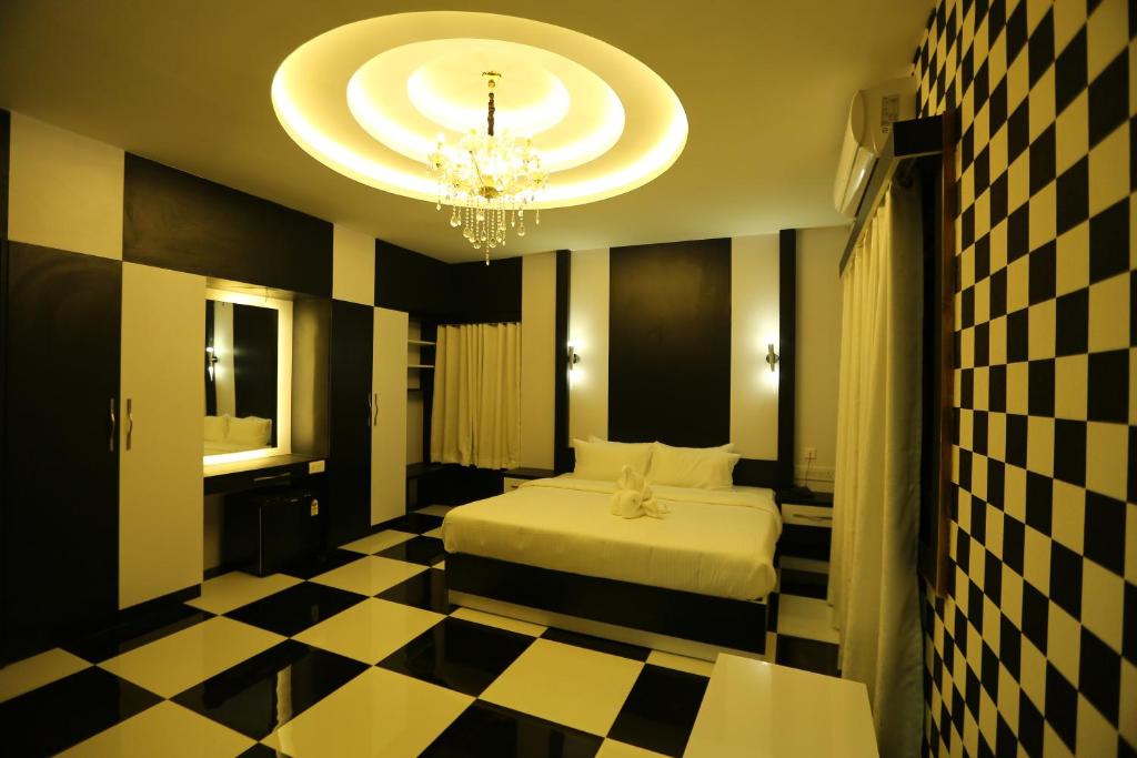 Postel nebo postele na pokoji v ubytování Mehar Inn Hotel