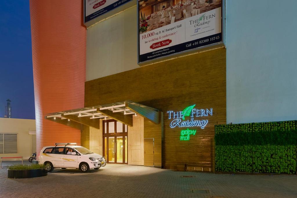 a car parked outside of a building with a sign at The Fern Residency Galaxy Mall in Āsansol