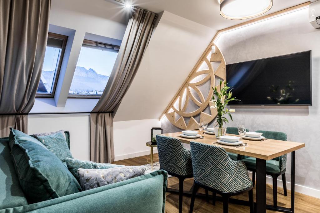Televízia a/alebo spoločenská miestnosť v ubytovaní Aparthotel Prestige & SPA