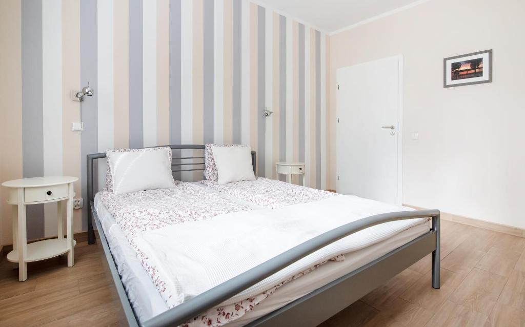 Posteľ alebo postele v izbe v ubytovaní Apartament pod Grotem z Widokiem na Jezioro, Oczy Mazur