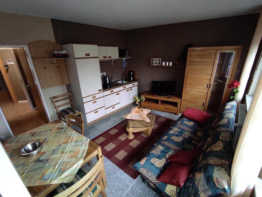 a living room with a couch and a table at Ferienwohnung Rhede in Rhede