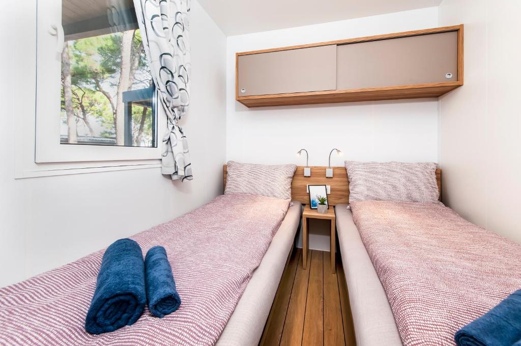 Posteľ alebo postele v izbe v ubytovaní FantaSea Mobile Home Porton Biondi