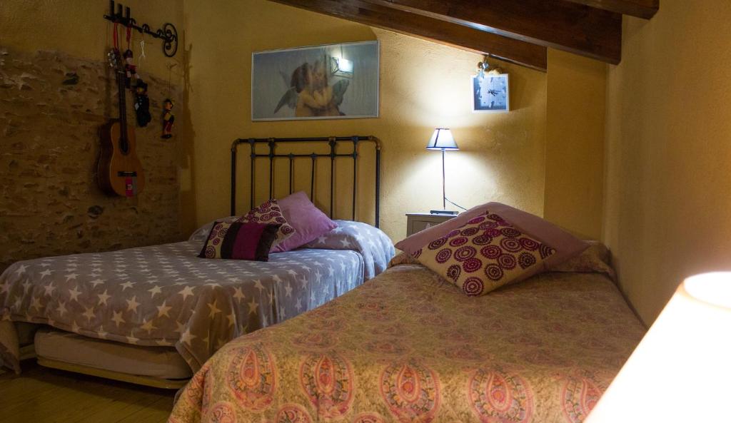 Postel nebo postele na pokoji v ubytování CASA CASTAÑÉ