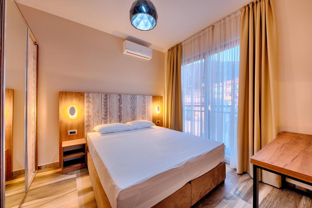 Letto o letti in una camera di Sunset Hotel