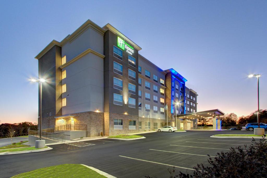 a rendering of a hotel in a parking lot at Holiday Inn Express & Suites Charlotte Southwest, an IHG Hotel in Charlotte