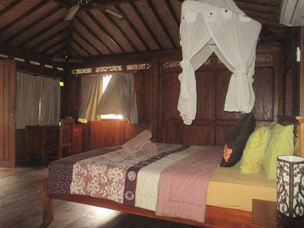 Postel nebo postele na pokoji v ubytování Green Paddy Hostel & Villa