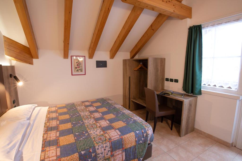 Postel nebo postele na pokoji v ubytování Residence Meridiana