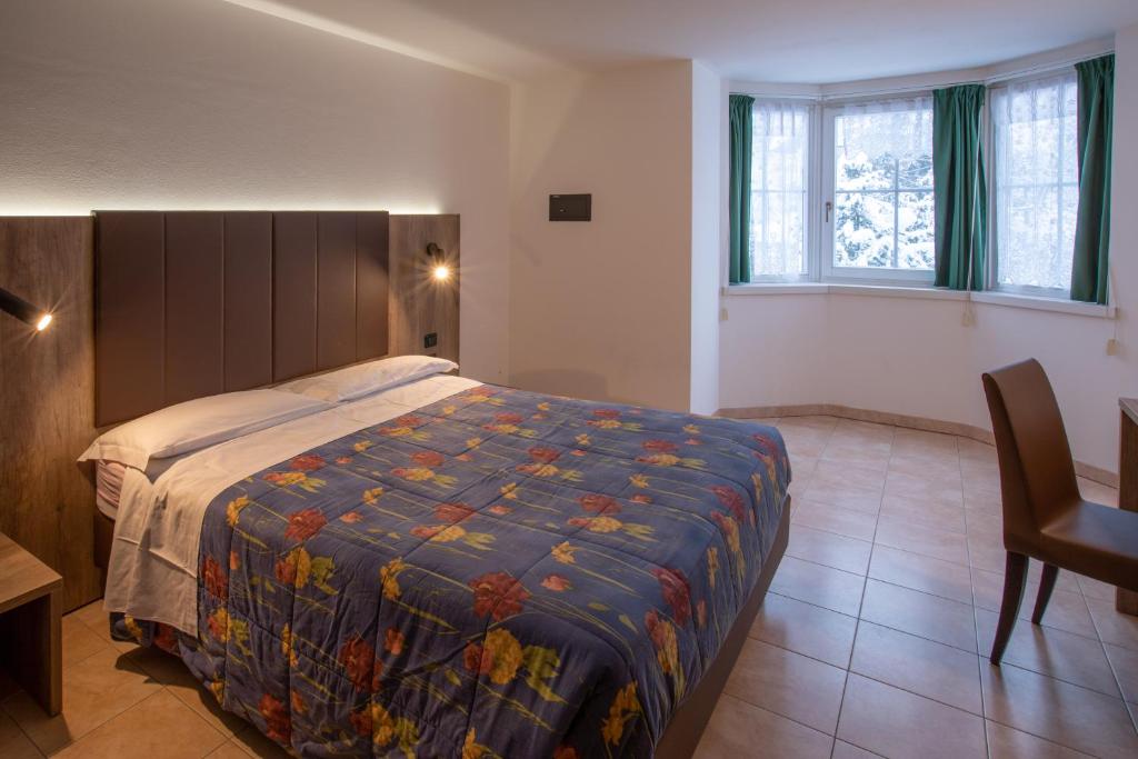 Postel nebo postele na pokoji v ubytování Residence Meridiana