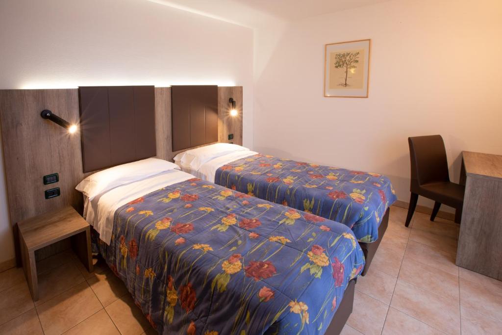Postel nebo postele na pokoji v ubytování Residence Meridiana