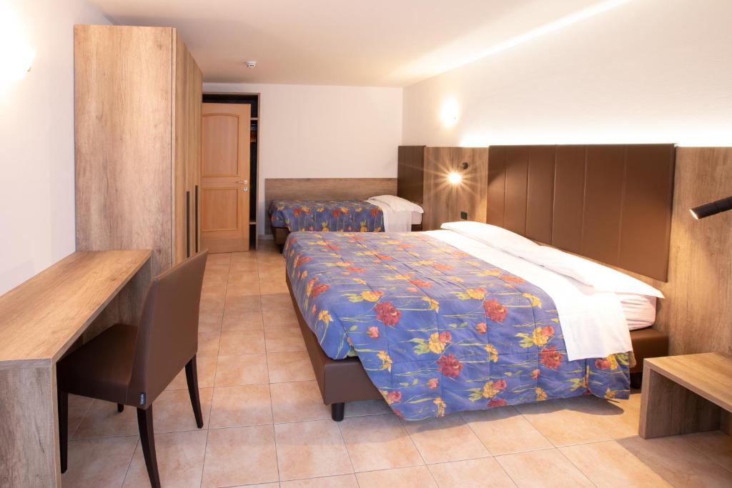 Postel nebo postele na pokoji v ubytování Residence Meridiana