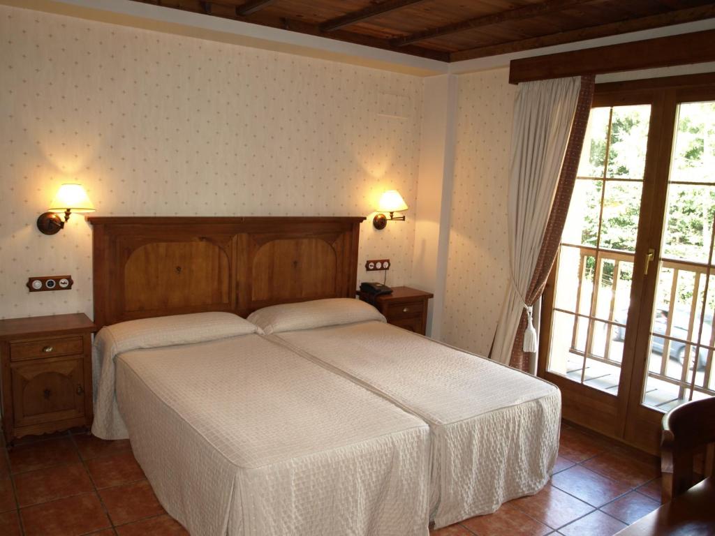 Postel nebo postele na pokoji v ubytování Hotel Bocalé