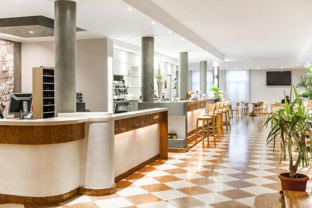 TV a/nebo společenská místnost v ubytování Club Hotel e Residence La Vela