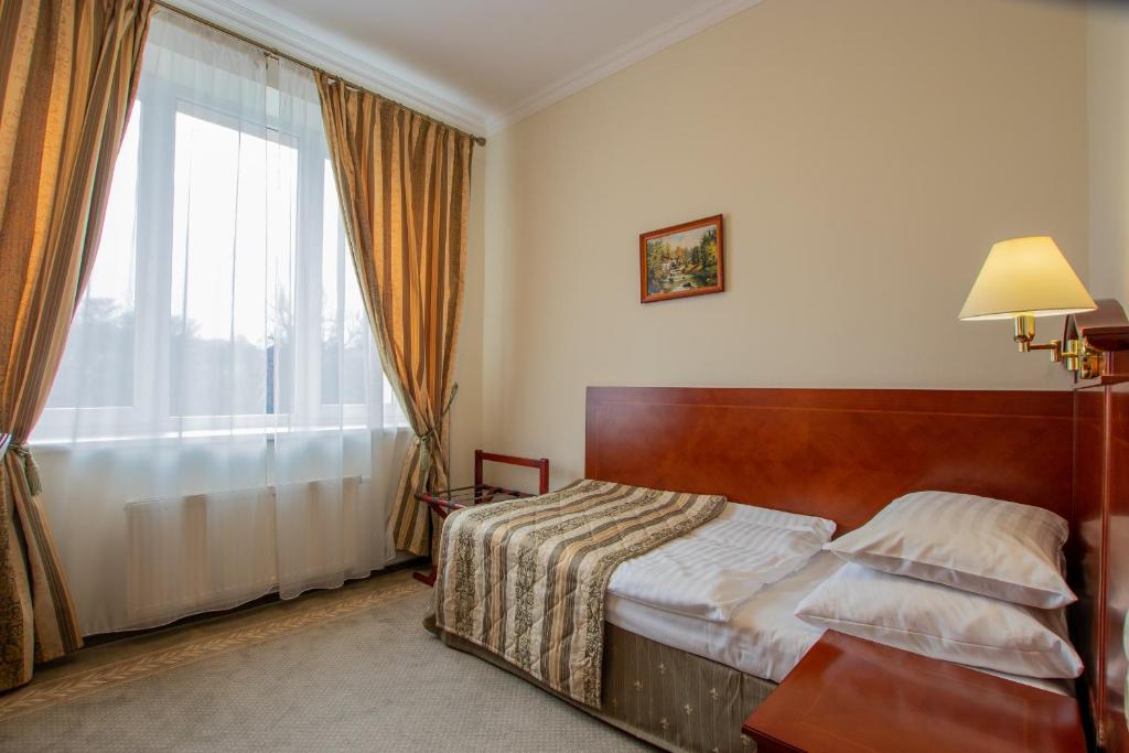 Postel nebo postele na pokoji v ubytování Hotel Giovanni Giacomo
