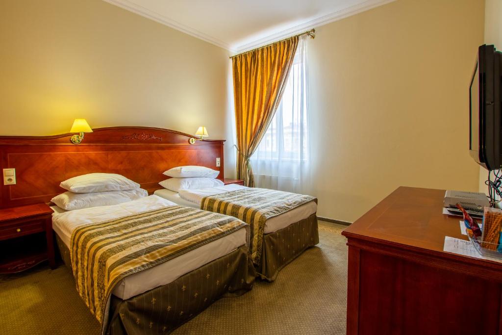 Postel nebo postele na pokoji v ubytování Hotel Giovanni Giacomo