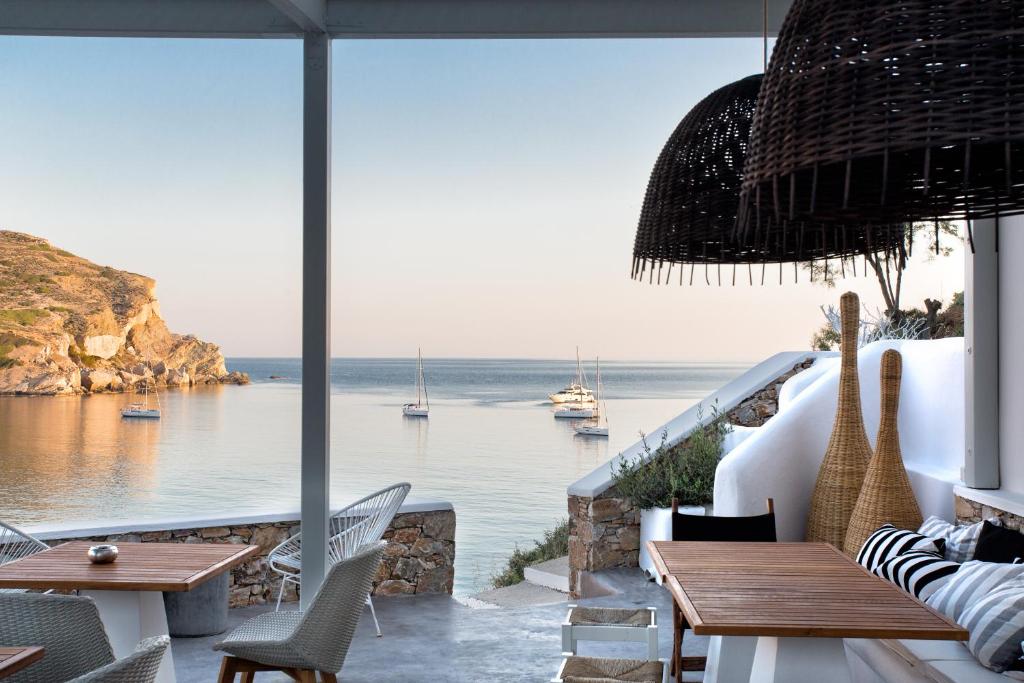 a restaurant with a view of the ocean at Blue Sand Boutique Hotel & Suites in Agali