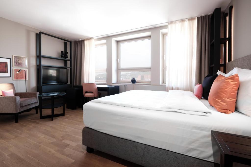 Postel nebo postele na pokoji v ubytování SAXX Hotel "Am Theater Karree"