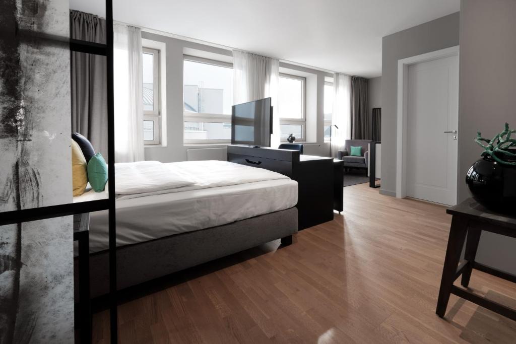 Postel nebo postele na pokoji v ubytování SAXX Hotel "Am Theater Karree"