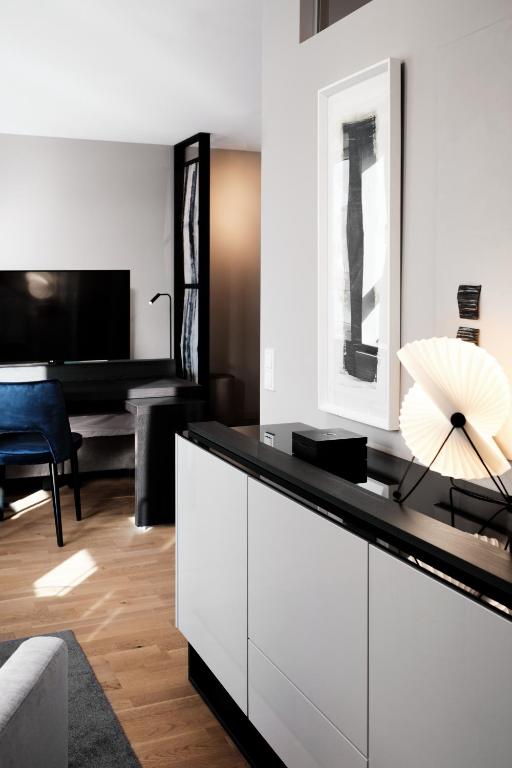 TV a/nebo společenská místnost v ubytování SAXX Hotel "Am Theater Karree"