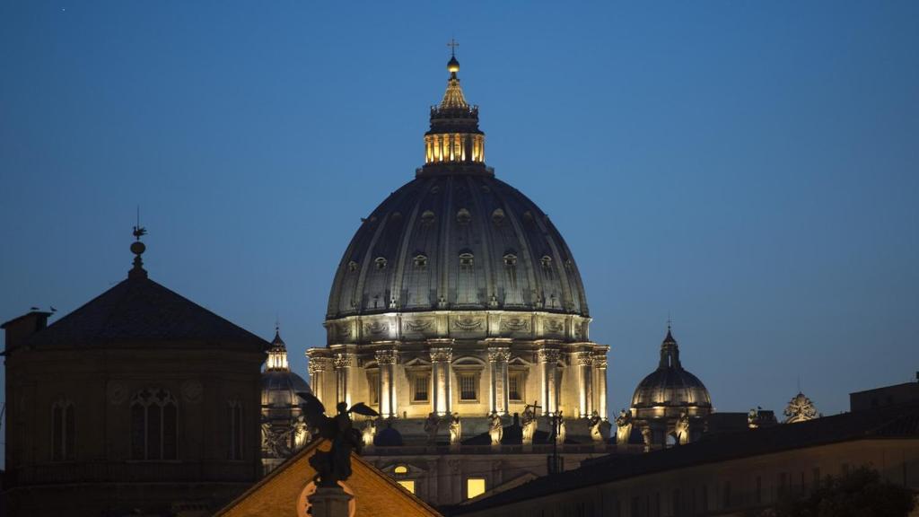a view of the dome of a building at night at Beside the Vatican in Rome