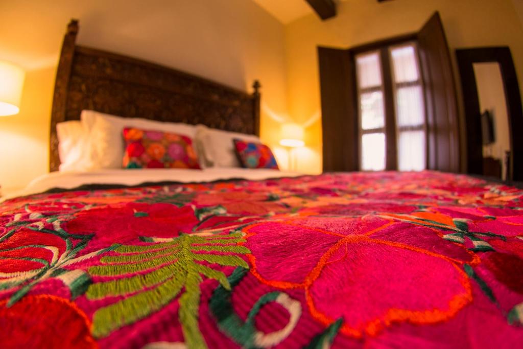 Postel nebo postele na pokoji v ubytování Hotel De La Soledad