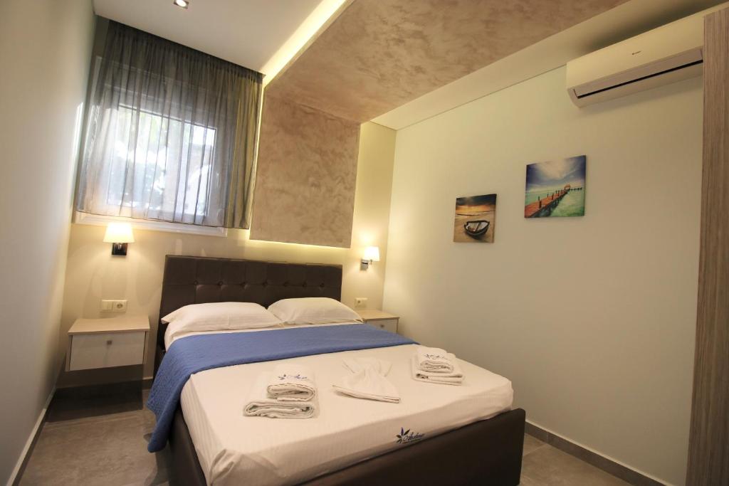 Postel nebo postele na pokoji v ubytování Deluxe Apartments Andreas