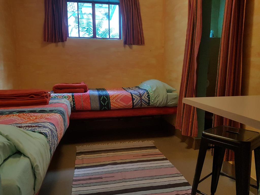Postel nebo postele na pokoji v ubytování The Cell Block Backpackers