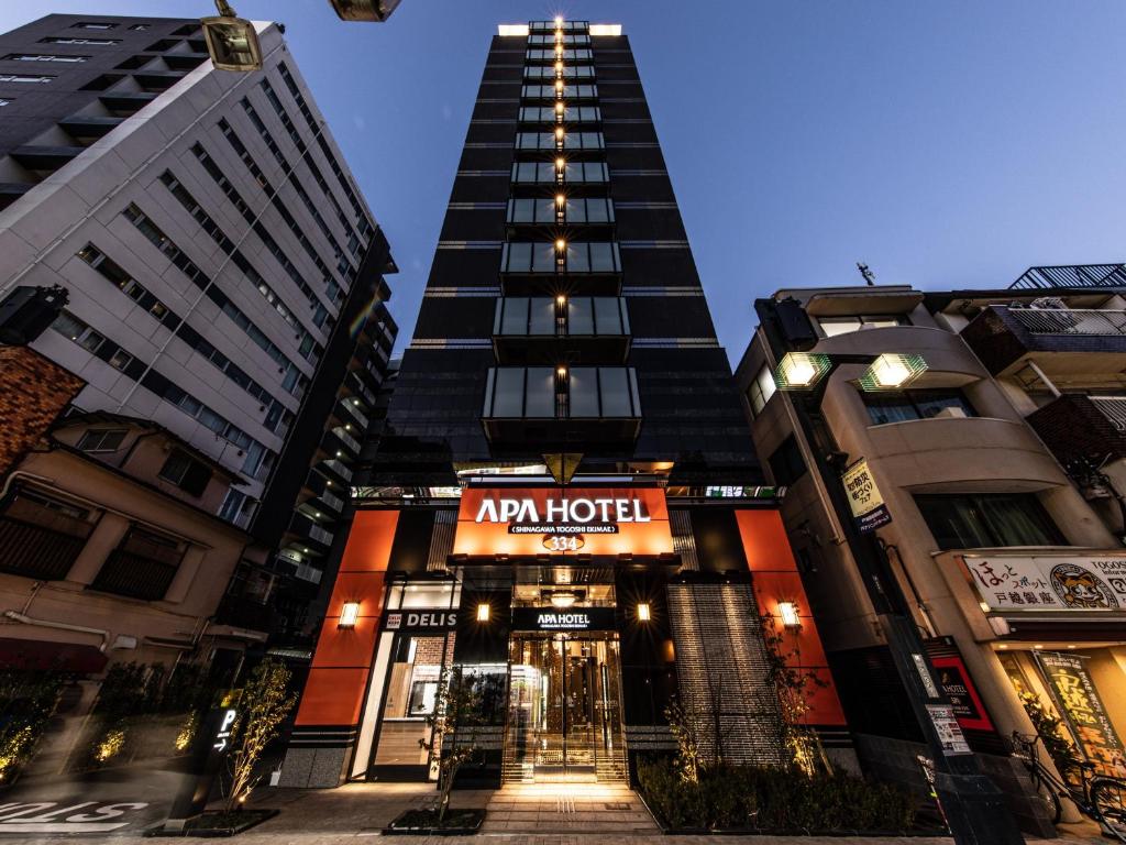 a hotel with a tall building in a city at APA Hotel Shinagawa Togoshi Ekimae in Tokyo