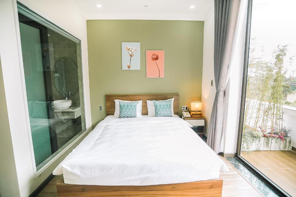 Postel nebo postele na pokoji v ubytování Memory Inn - Green Villa
