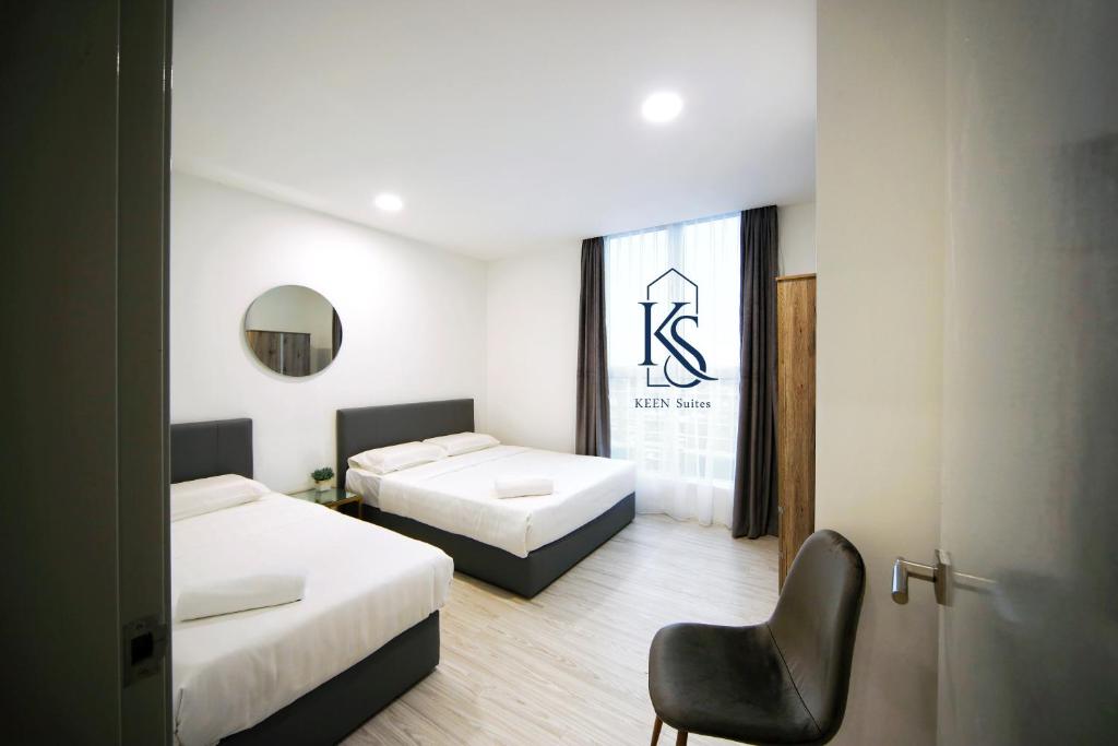 KEEN Suites@Sutera Avenueにあるベッド