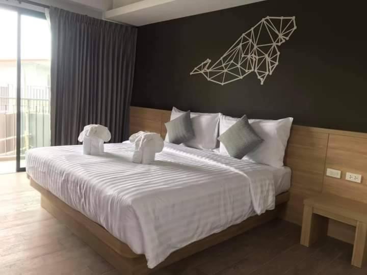 Postel nebo postele na pokoji v ubytování Aonang Dugong-SHA Extra Plus