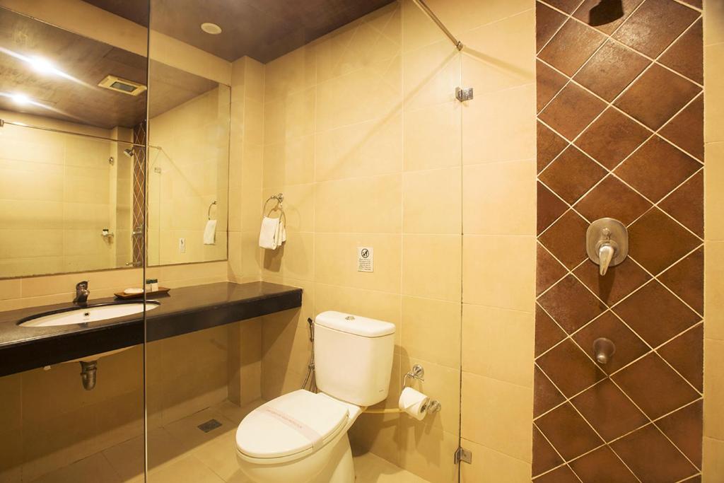 a bathroom with a toilet and a sink at Sea Shell Resort & Spa, Havelock in Havelock Island