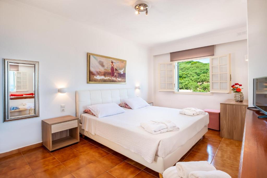 Postel nebo postele na pokoji v ubytování CORFU PELAGOS HOTEL