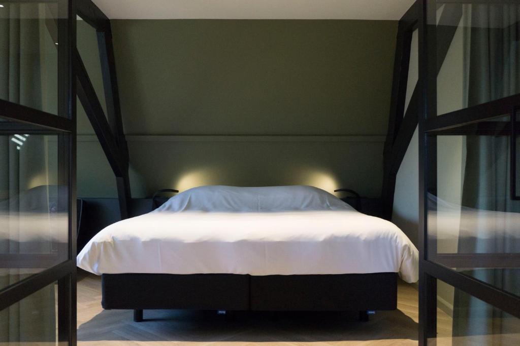 Postel nebo postele na pokoji v ubytování Hotel Central