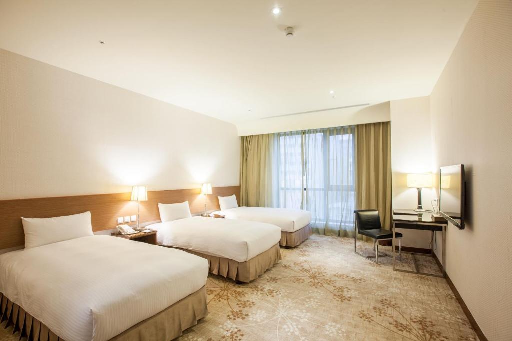 Postel nebo postele na pokoji v ubytování Taisugar Hotel Taipei