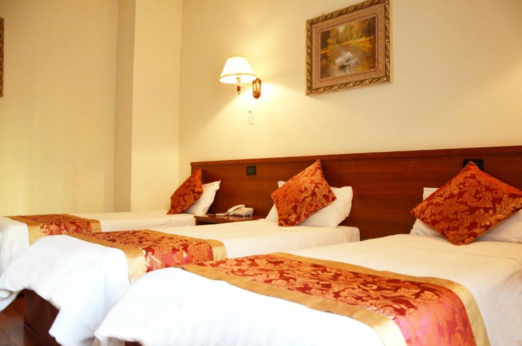 Postel nebo postele na pokoji v ubytování Hotel Geo
