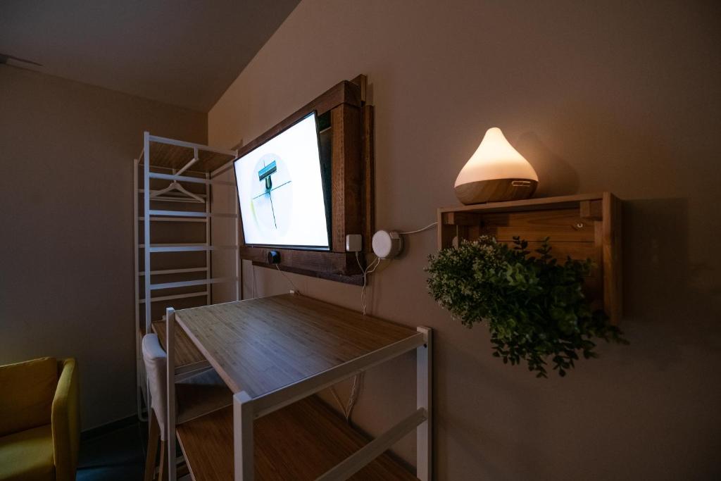 Televízia a/alebo spoločenská miestnosť v ubytovaní Dannunziano Aparthotel