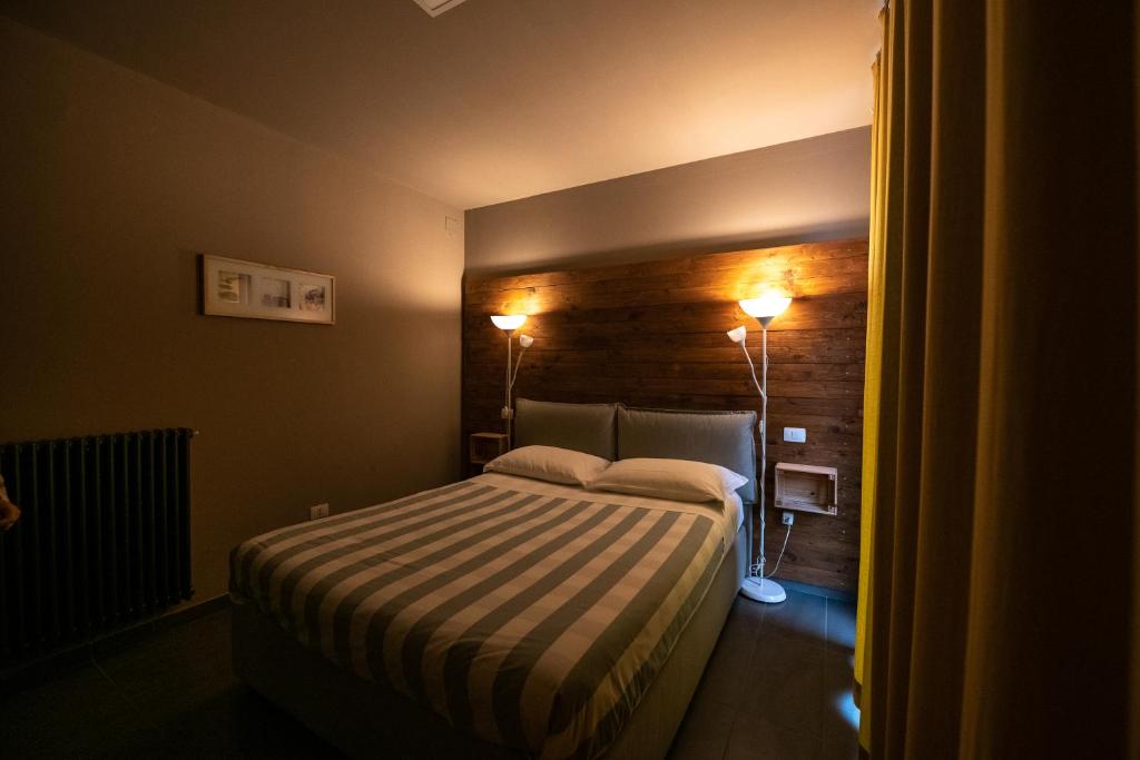 Posteľ alebo postele v izbe v ubytovaní Dannunziano Aparthotel