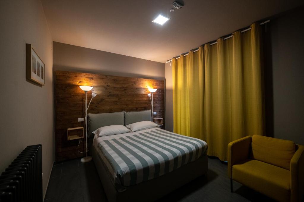 Posteľ alebo postele v izbe v ubytovaní Dannunziano Aparthotel