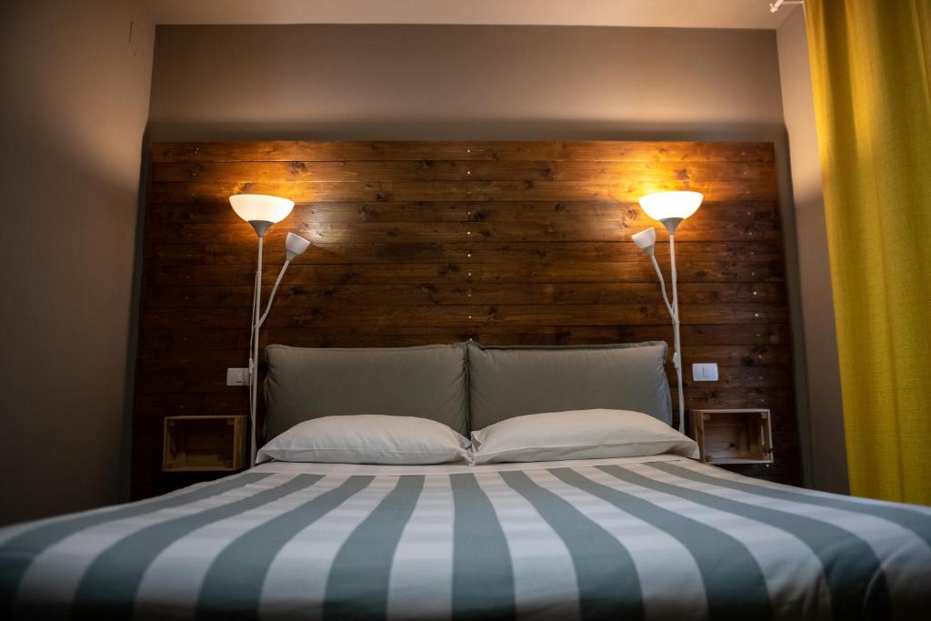 Posteľ alebo postele v izbe v ubytovaní Dannunziano Aparthotel