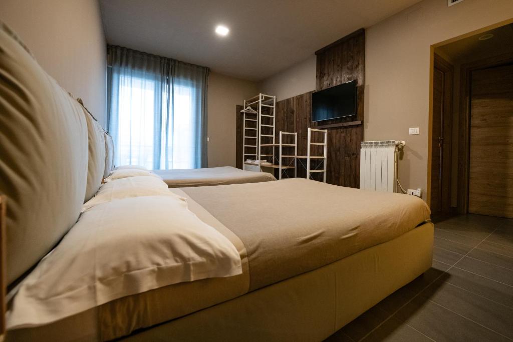 Posteľ alebo postele v izbe v ubytovaní Dannunziano Aparthotel