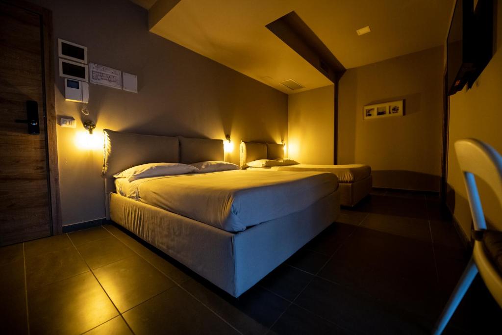 Posteľ alebo postele v izbe v ubytovaní Dannunziano Aparthotel