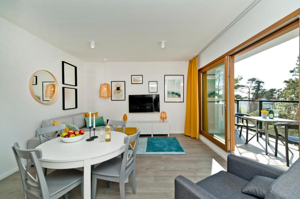 Televízia a/alebo spoločenská miestnosť v ubytovaní BlueApart Verano Residence
