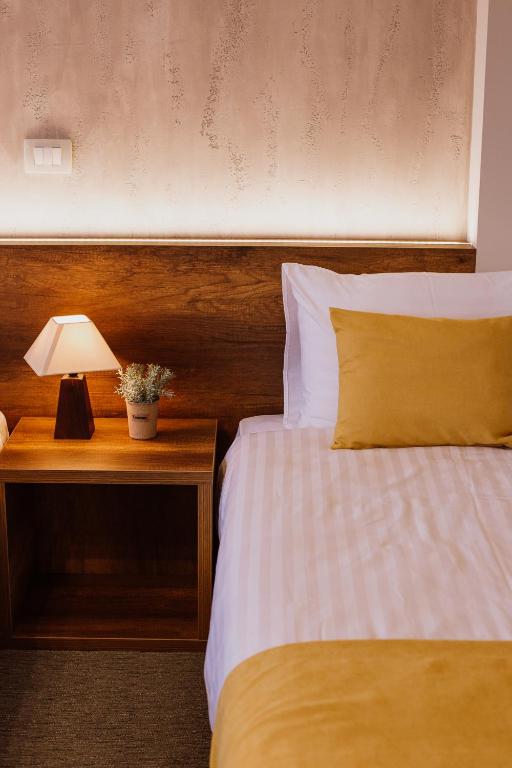 Postel nebo postele na pokoji v ubytování Hotel Kapri