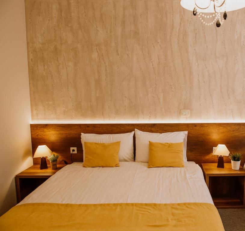 Postel nebo postele na pokoji v ubytování Hotel Kapri