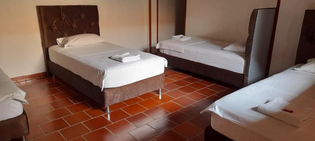 Llit o llits en una habitació de Posada San Luis