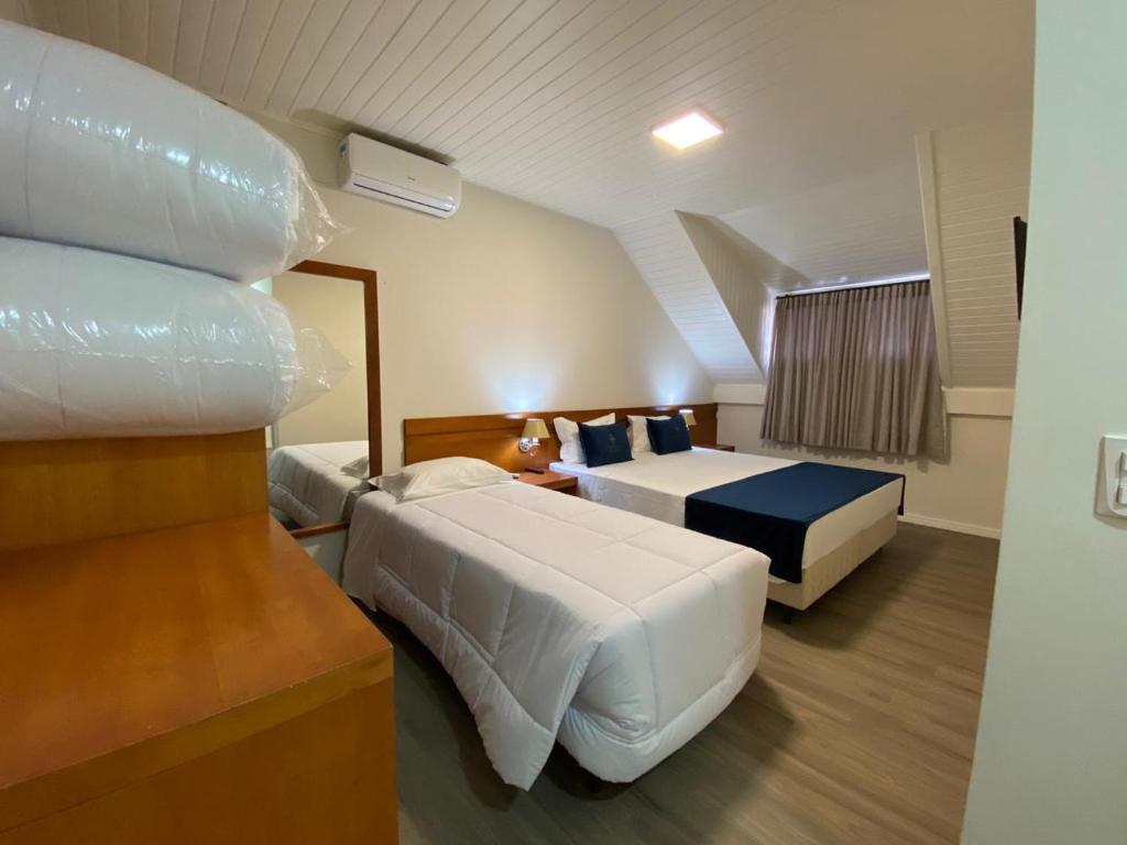 เตียงในห้องที่ Lapônia Hotel Gramado
